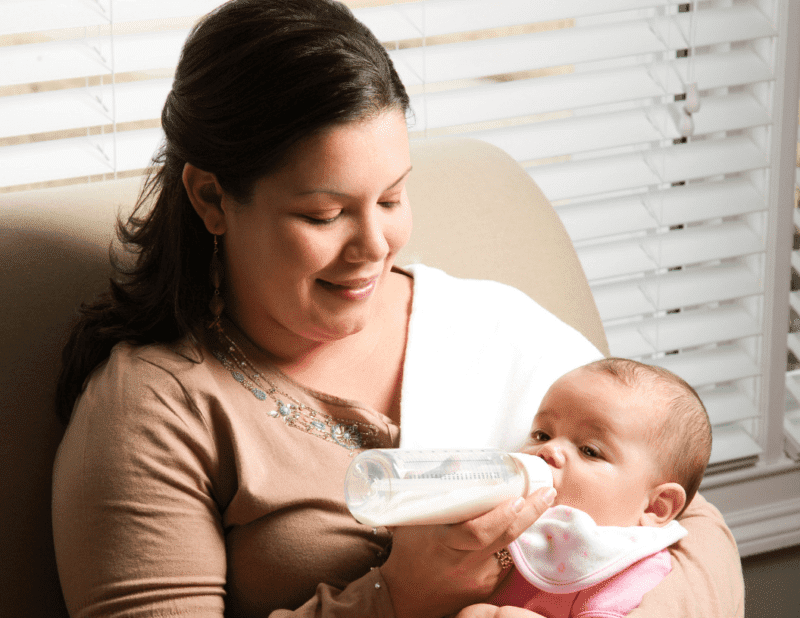 Mother and baby practicing paced bottle feeding